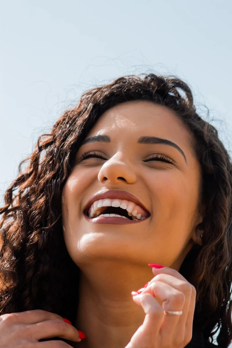 Patient with beautiful smile after dental treatment